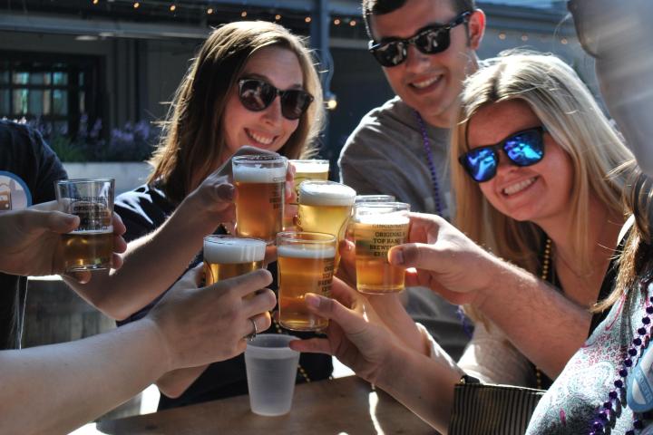 A group having craft beers in Cincinnati.